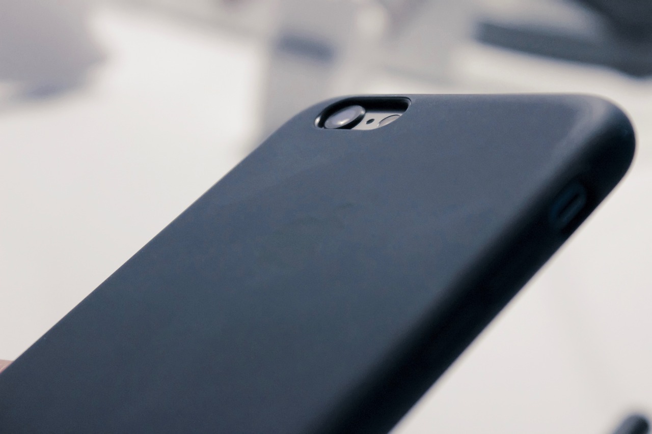 Will an adhesive grip stick to my case?